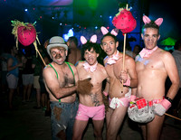 Four partygoers wearing Three Little Pigs-themed costumes pose during the annual Pines Party in Fire Island.