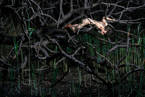 Figure emerging from the ashes in the burnt section of the Meat Rack on Fire Island, photographed by koitz