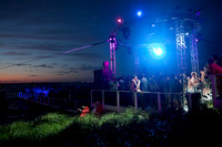 People dancing at the Bay Dance Party in Fire Island Pines, New York, during sunset. Documentary photograph capturing one of Fire Island's iconic LGBTQ+ nightlife events by koitz.