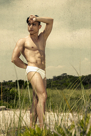 Model standing in the dunes on Fire Island, photographed by koitz
