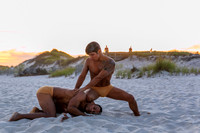 Boffo performs in the Fire Island Pines at sunset in this atmospheric photograph by koitz Photography, capturing the energy of Fire Island nightlife.