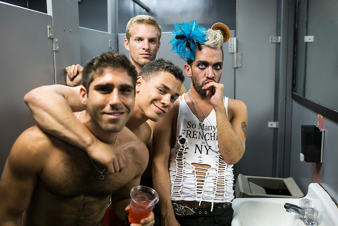 Men gathered in a bathroom on Fire Island, New York