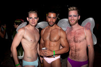 Posing for the camera at the Pines Party in Fire Island Pines, captured by koitz Photography during the iconic summer celebration.