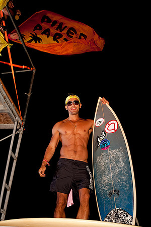 koitz Photography photograph of a surfer arriving at the Pines Party in Fire Island.