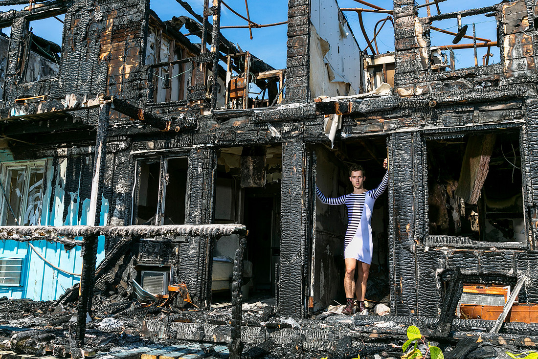 Brock poses in the interior of the historic Grove Hotel in Cherry Grove, Fire Island, as part of koitz’s photographic project Brock in a Dress, documenting the hotel before it was destroyed by fire in