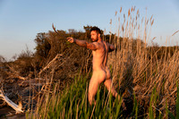 Artistic nude standing outdoors on Fire Island, photographed by koitz in a fine art coastal landscape setting.