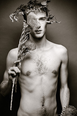 Artistic nude surrounded by flowers in a fine art photographic composition by koitz.