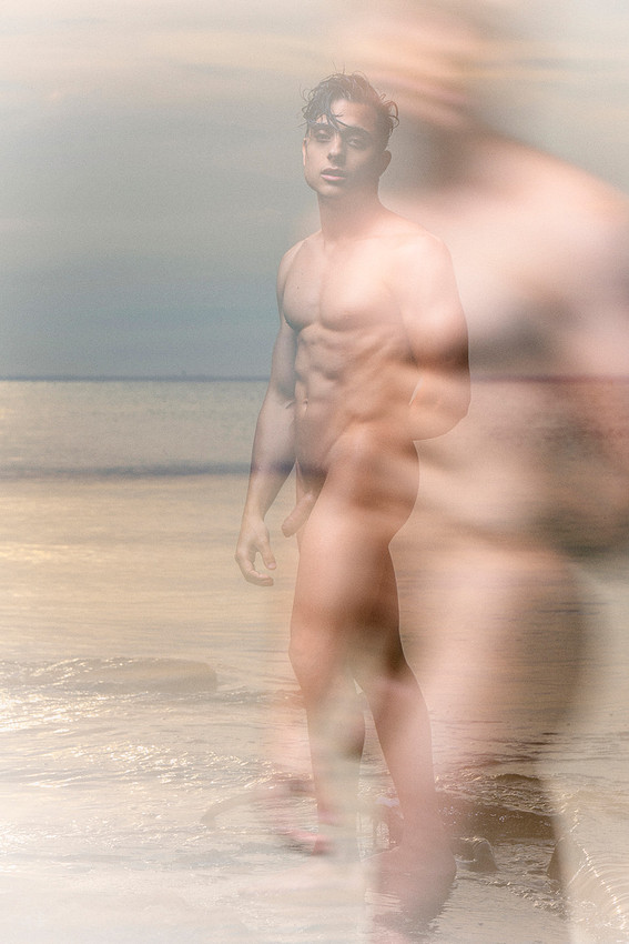 Andy standing by the Great South Bay on Fire Island in a fine art queer photography portrait by koitz.
