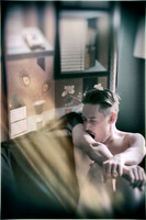 Discover a fine art portrait featuring a nude model captured in a natural yawning moment. A contemporary queer photography work exploring vulnerability, expression, and artistic storytelling.