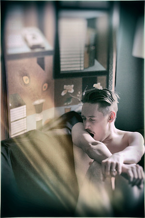 Discover a fine art portrait featuring a nude model captured in a natural yawning moment. A contemporary queer photography work exploring vulnerability, expression, and artistic storytelling.