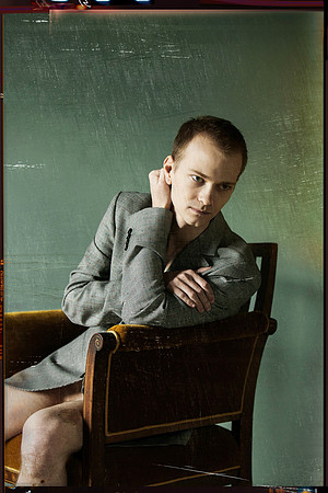 Model seated on a chair, photographed by koitz.