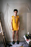 Brock wearing a Club Kid–inspired dress in an editorial fashion portrait.