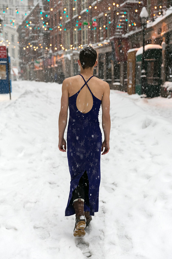 Brock wearing a dress while walking through a snow-covered landscape during winter. By koitz