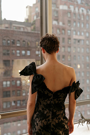 Portrait of Brock wearing a dress and looking out a window in a contemporary queer photography artwork by koitz.