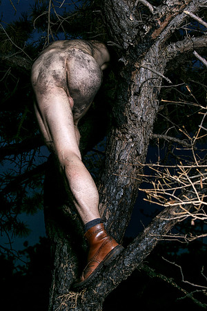 Brock exploring the burnt landscape of the Meat Rack on Fire Island in boots, photographed by koitz.