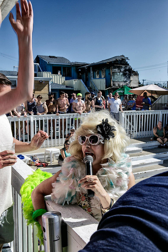 Lavinia Draper Performing with the Burned Grove Hotel in the Background